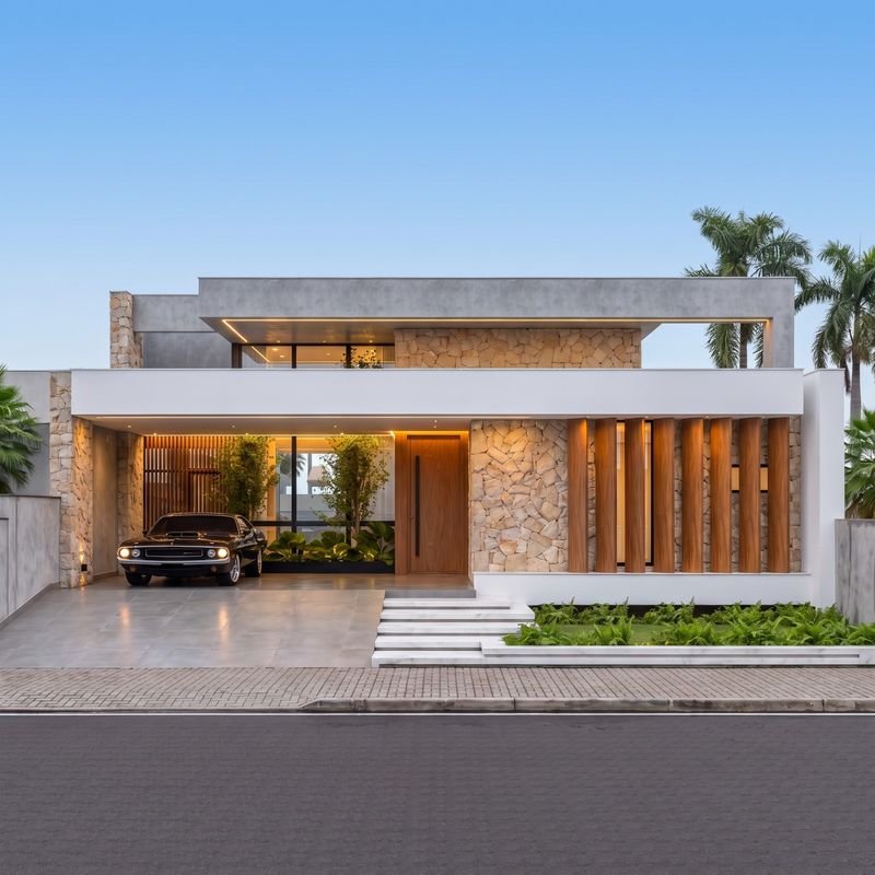 Fachada frontal da casa térrea de alto padrão no Loteamento Tumelero, com pedra natural, ripado de madeira e garagem coberta (projeto) — casa de alto padrão à venda no Cadorin, Pato Branco